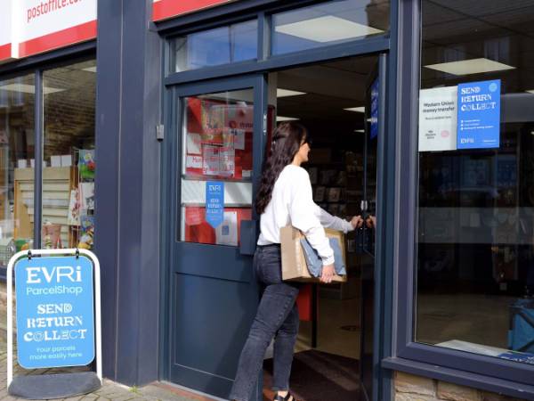 lady walking into a post office branch