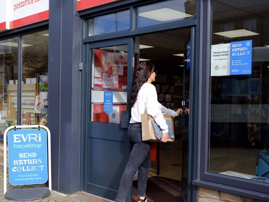 lady walking into a post office branch