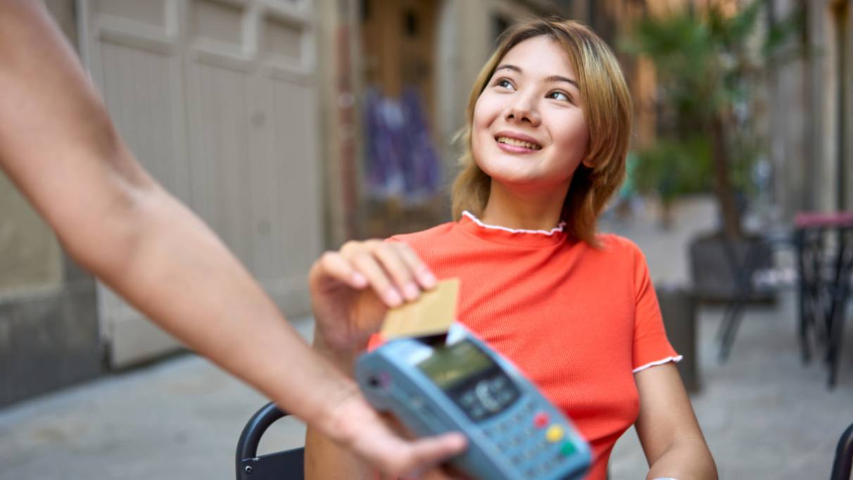 lady making a payment using her card