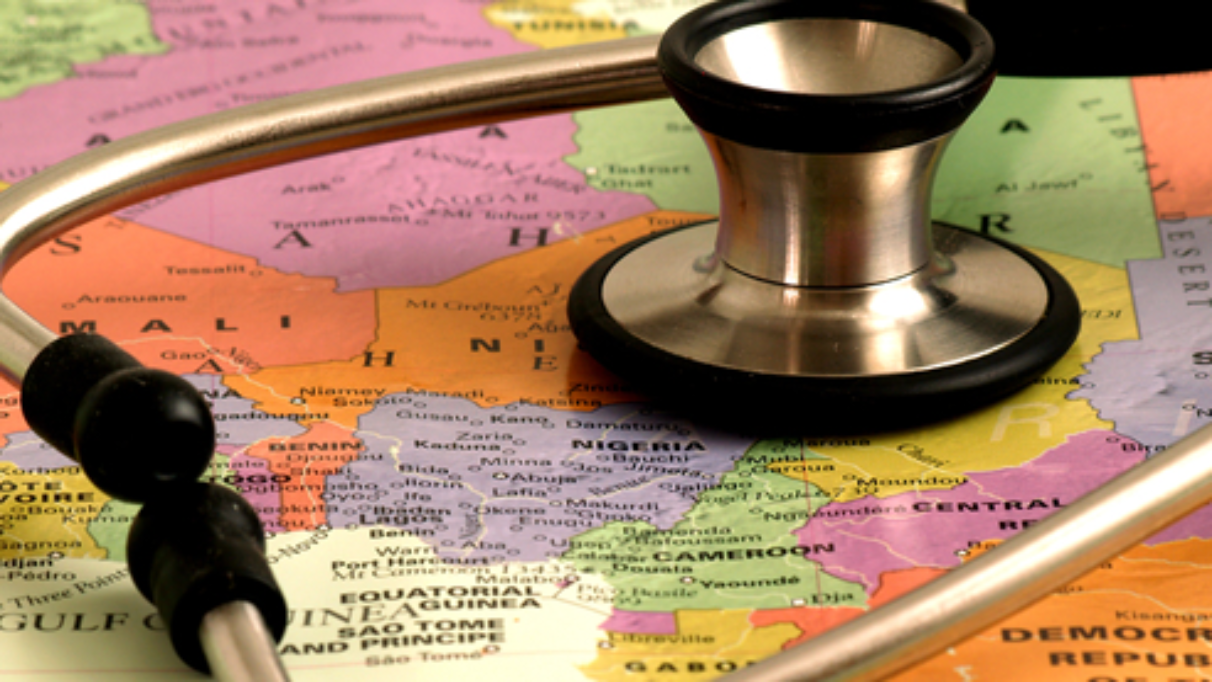 Doctor stethoscope resting on top of a world map