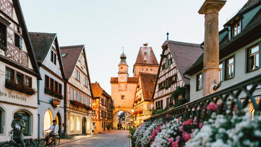 Medieval German town with cobbled street and flowers