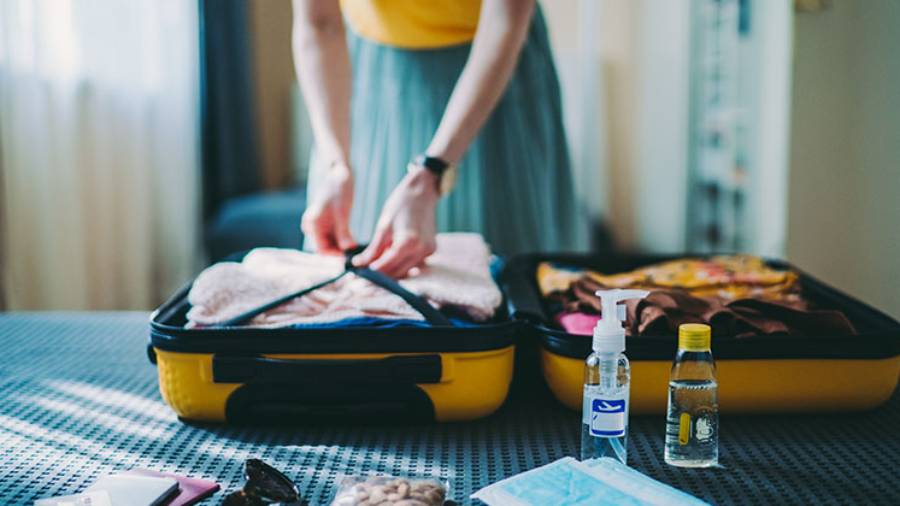 Woman packing her suitcase