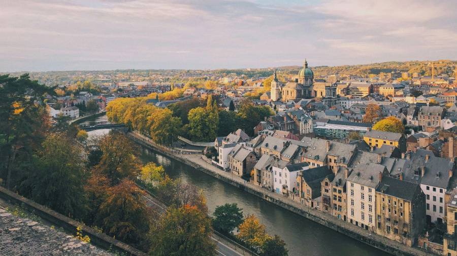 Aerial view of city buildings and a waterway during daytime