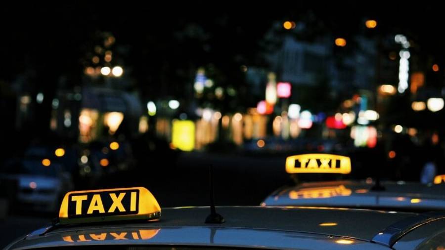 two taxis at night in the city