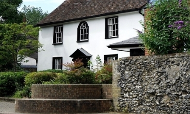 Big cottage white white walls and black window 