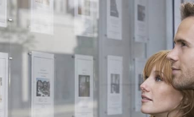 Young couple looking ad house listings