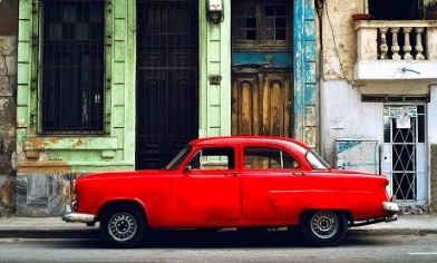 Classic red car parked in Havana street, Cuba