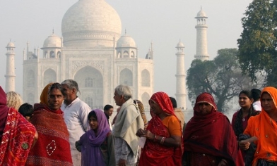 Taj Mahal in distance with people in the foreground