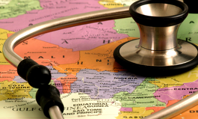 Doctor stethoscope resting on top of a world map