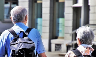 Senior citizens travelling and holding hands