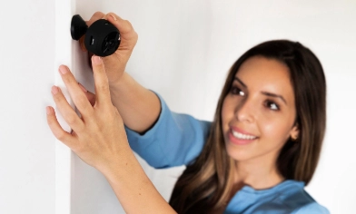 woman aligning her security camera