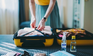 Woman packing her suitcase