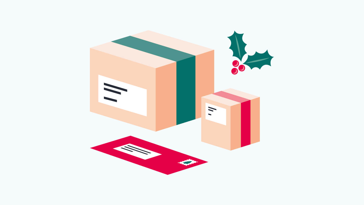 a letter and two parcels in festive colours with a holly cluster