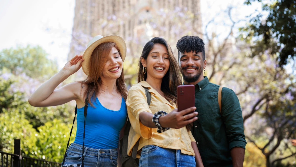 three travellers smiling for a selfie in the jungle