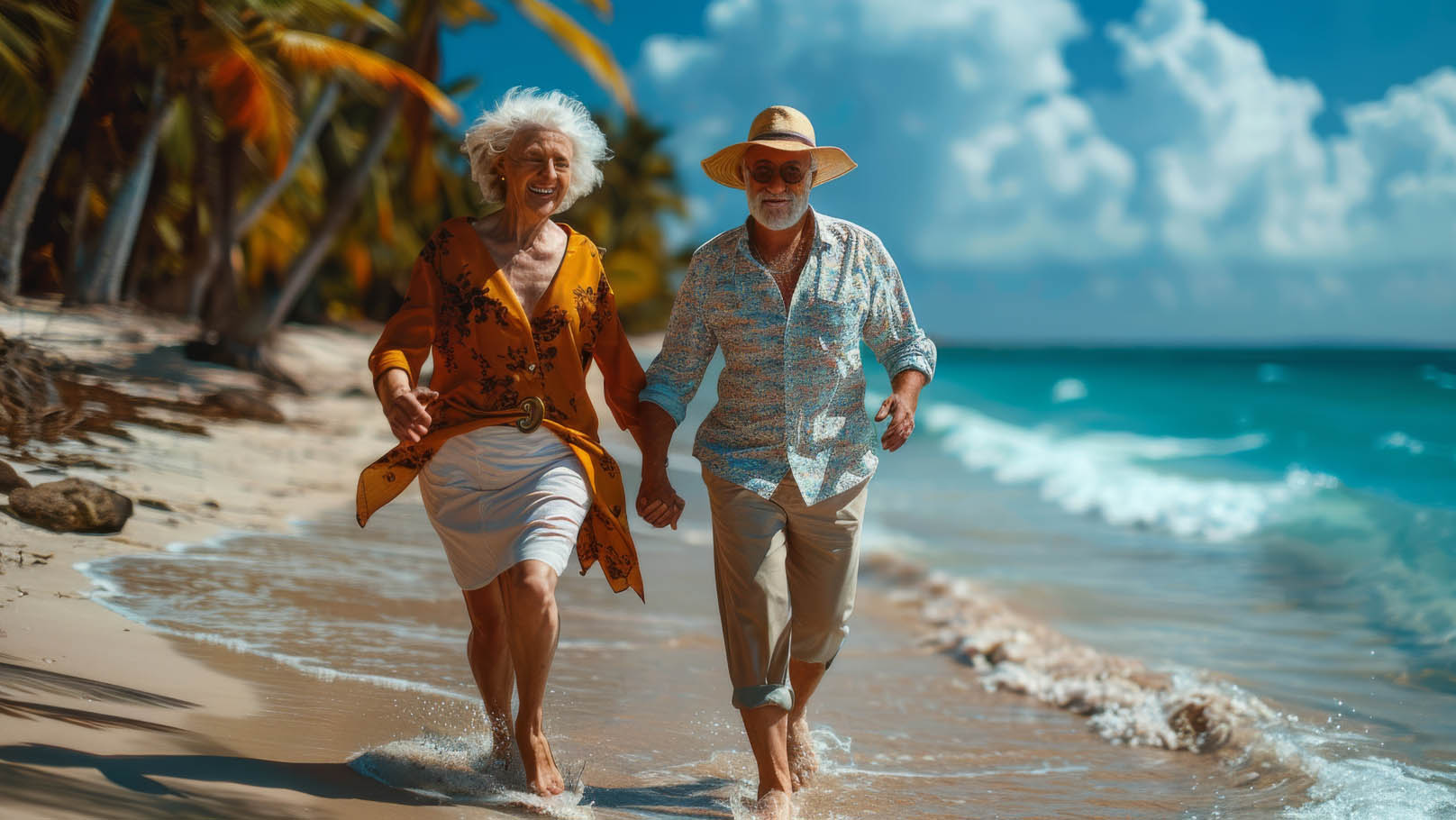 Senior citizens holding hands on a beach