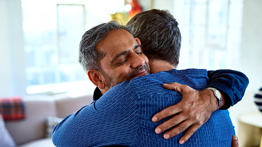 two people hugging in condolence
