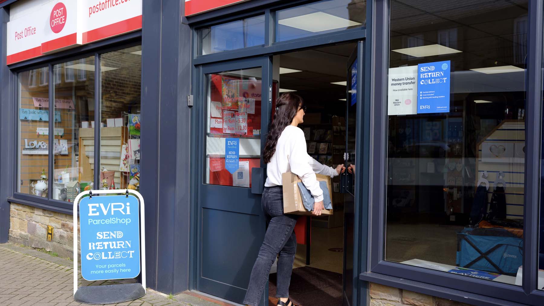 lady walking into a post office branch