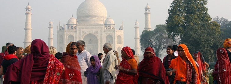 Taj Mahal in distance with people in the foreground