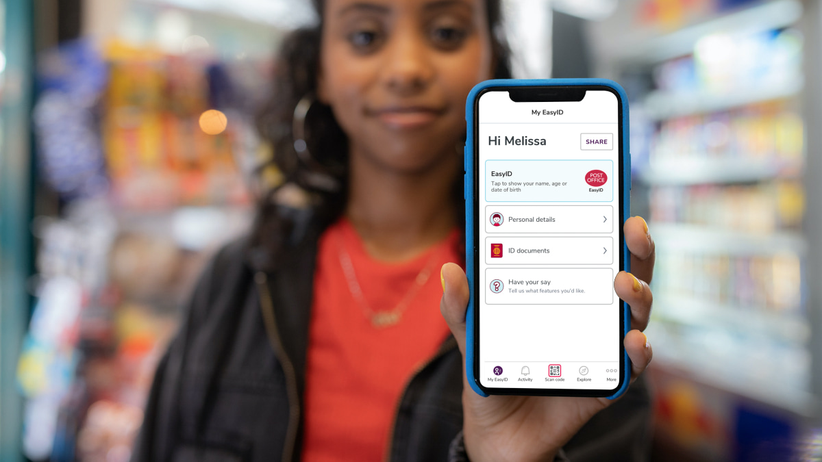 Girl holding phone up showing Identity services