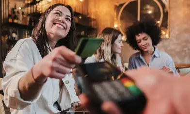 lady making a payment with her card