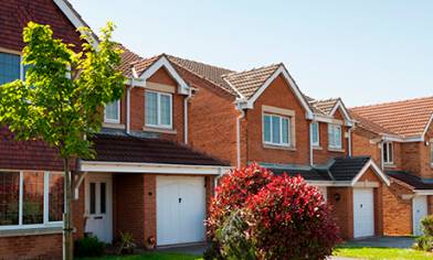 Rows of brick houses with small trees in front