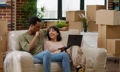 a couple having a discussion after moving in with boxes in the background