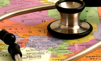 Doctor stethoscope resting on top of a world map