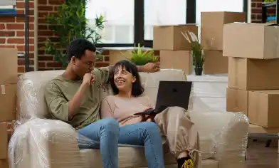a couple having a discussion after moving in with boxes in the background