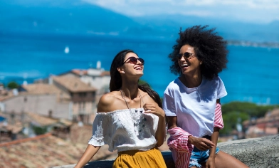 two women smiling and laughing