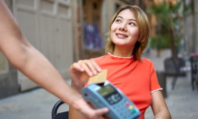 lady making a payment using her card